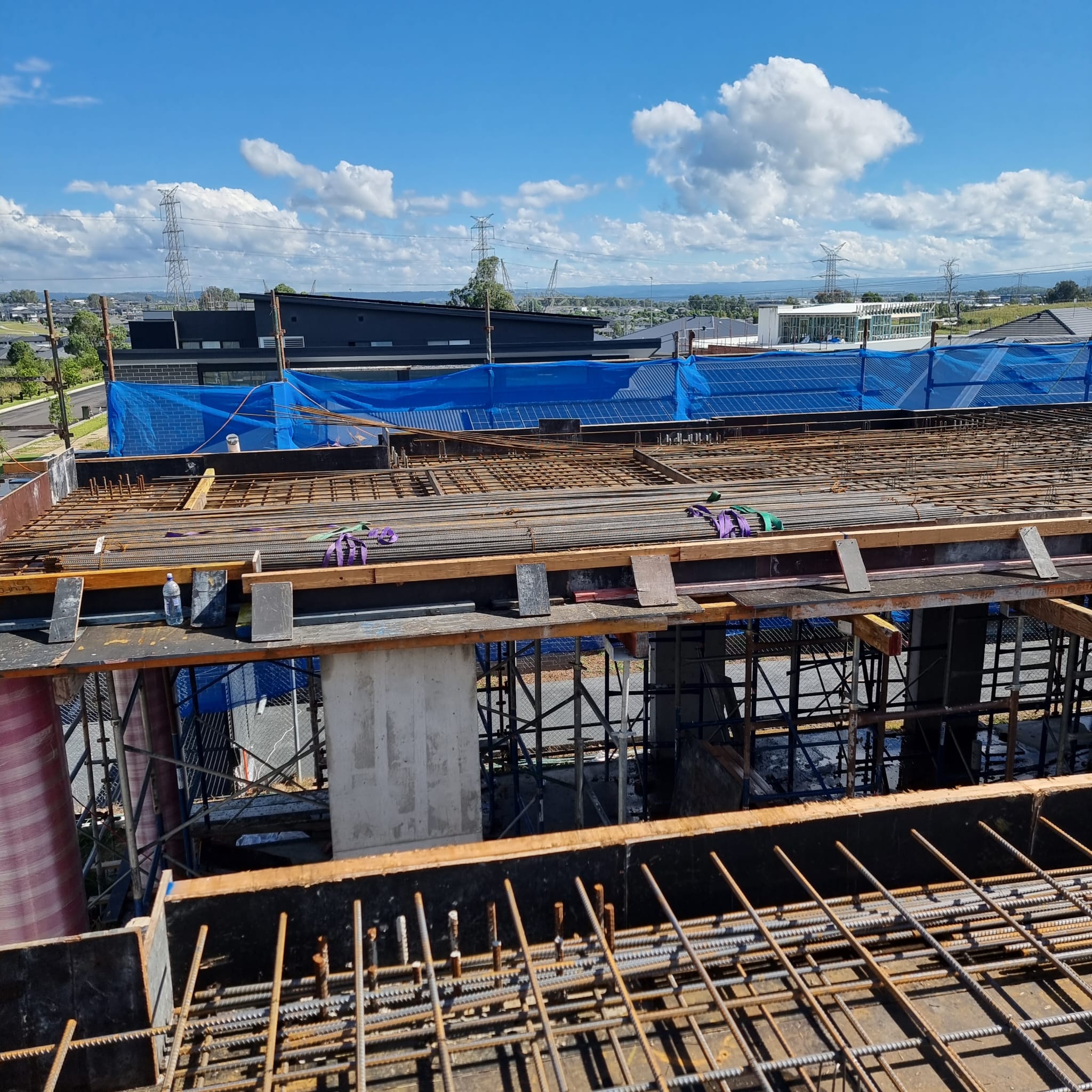 QACO construction project — suspended-slab formwork and reinforcement